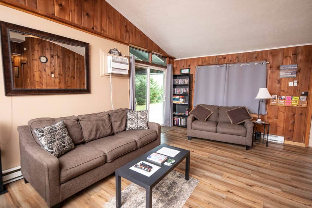 cozy and comfortable living room area - bookshelf houses a variety of DVD's, books and games for your enjoyment while here cozy and comfortable living room area - bookshelf houses a variety of DVD's, books and games for your enjoyment while here