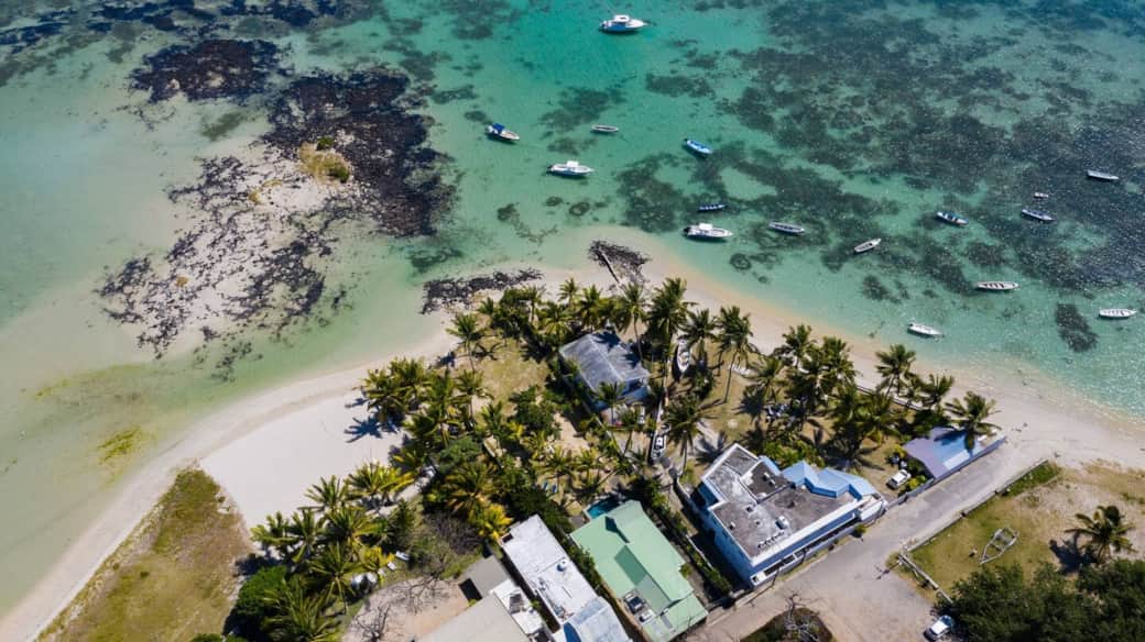 Aerial view of Nelson road with the lagoon, beach & properties.