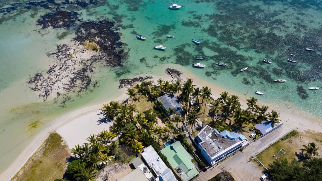 Aerial view of Nelson road with the lagoon, beach & properties.