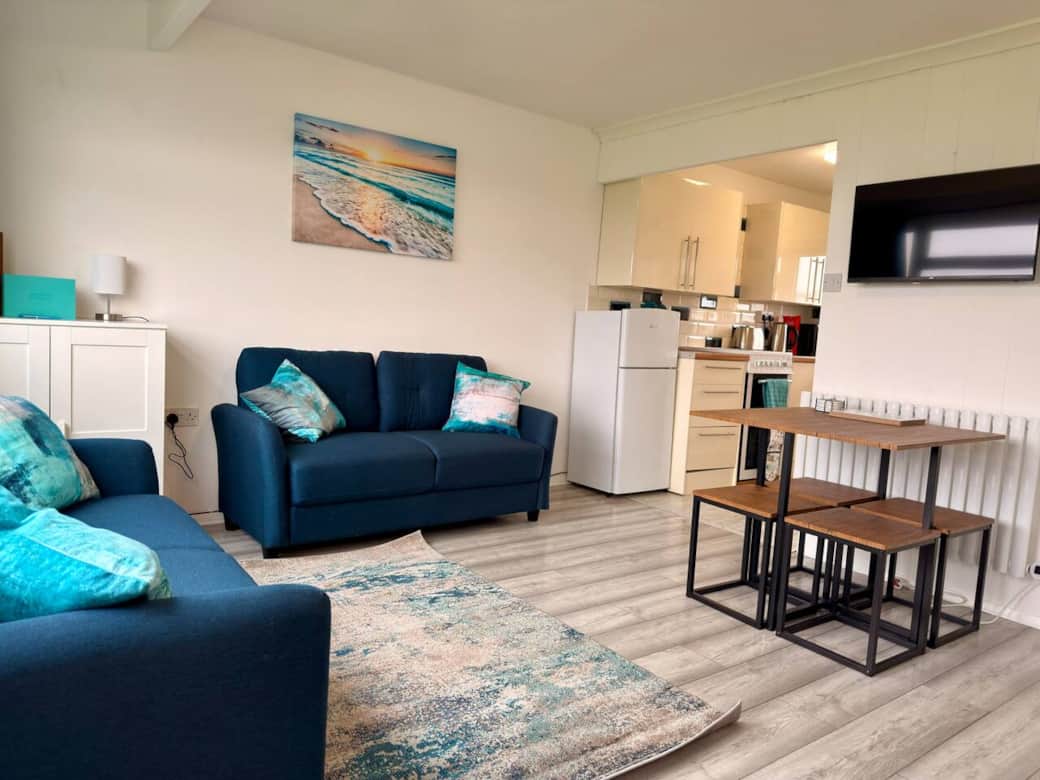 Modern open-plan living area with Smart TV and comfortable seating