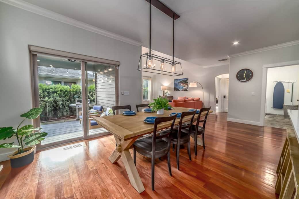 Dining area - large table with six chairs + bench if needed.  Table leaves are available to extend each side for approved gatherings.