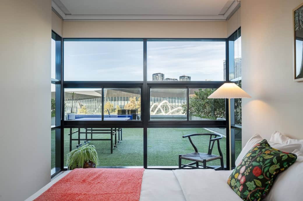 Bedroom with views of your private terrace and city skyline Bedroom with views of your private terrace and city skyline