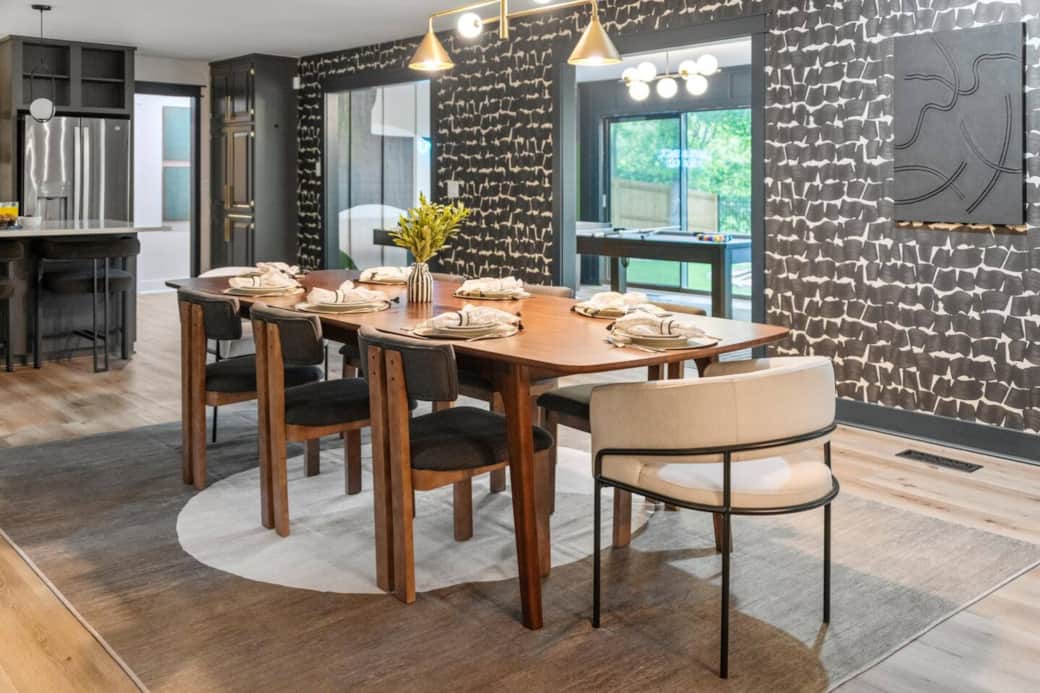 Gather around the 8-seat dining table—perfectly placed for easy meals, conversation, and connection.