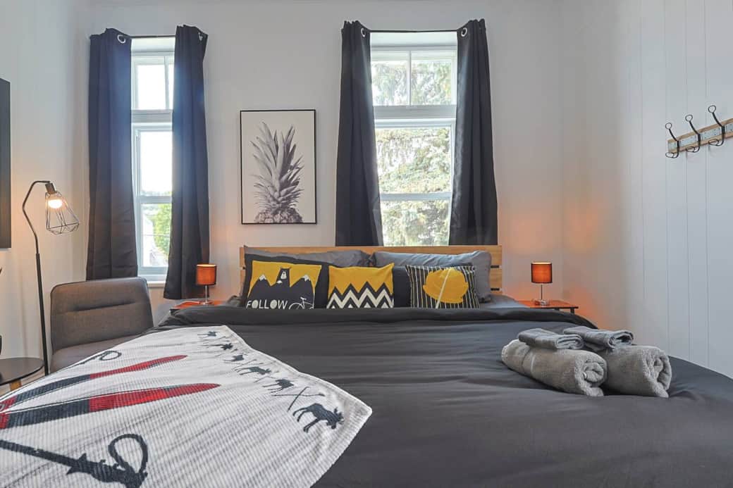 First huge master bedroom with king bed and reading corner