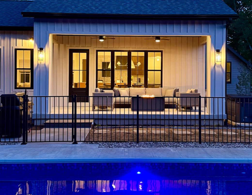 The back patio overlooking the pool at dusk