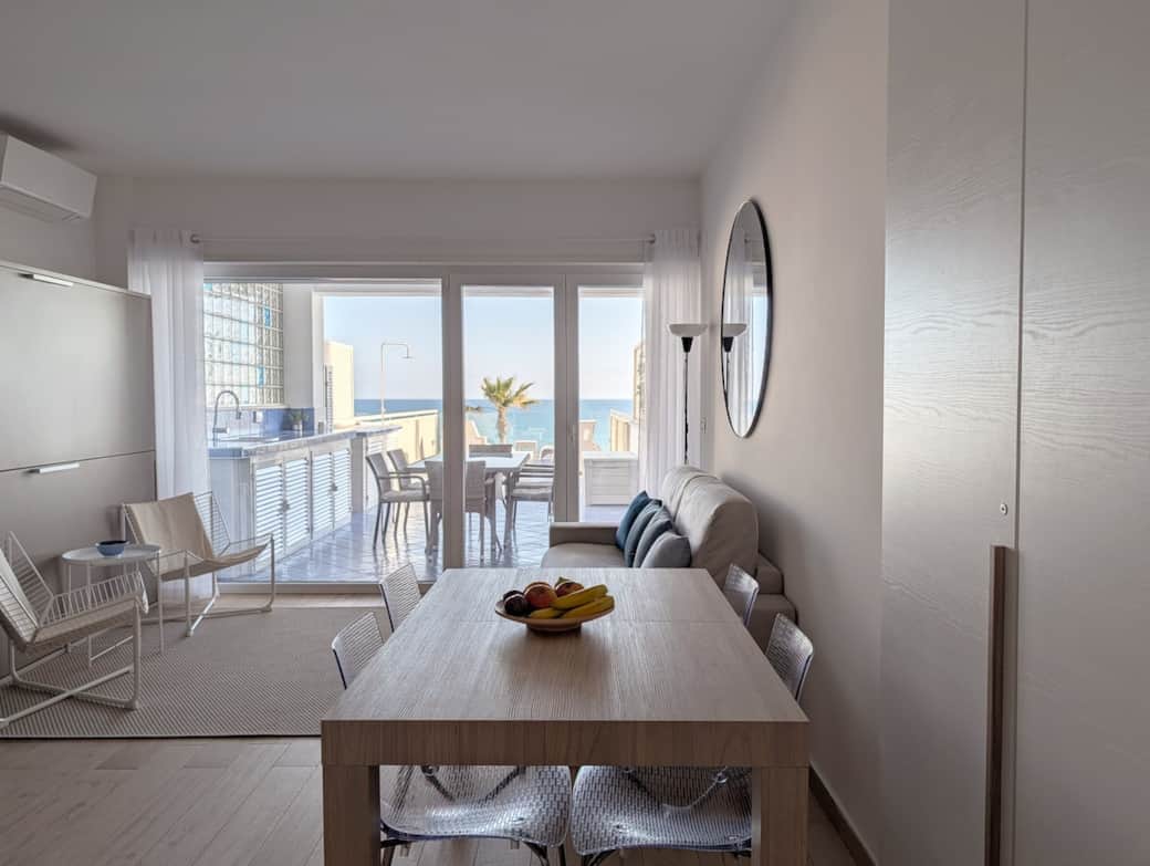 Bright living area opening onto the sea-view terrace