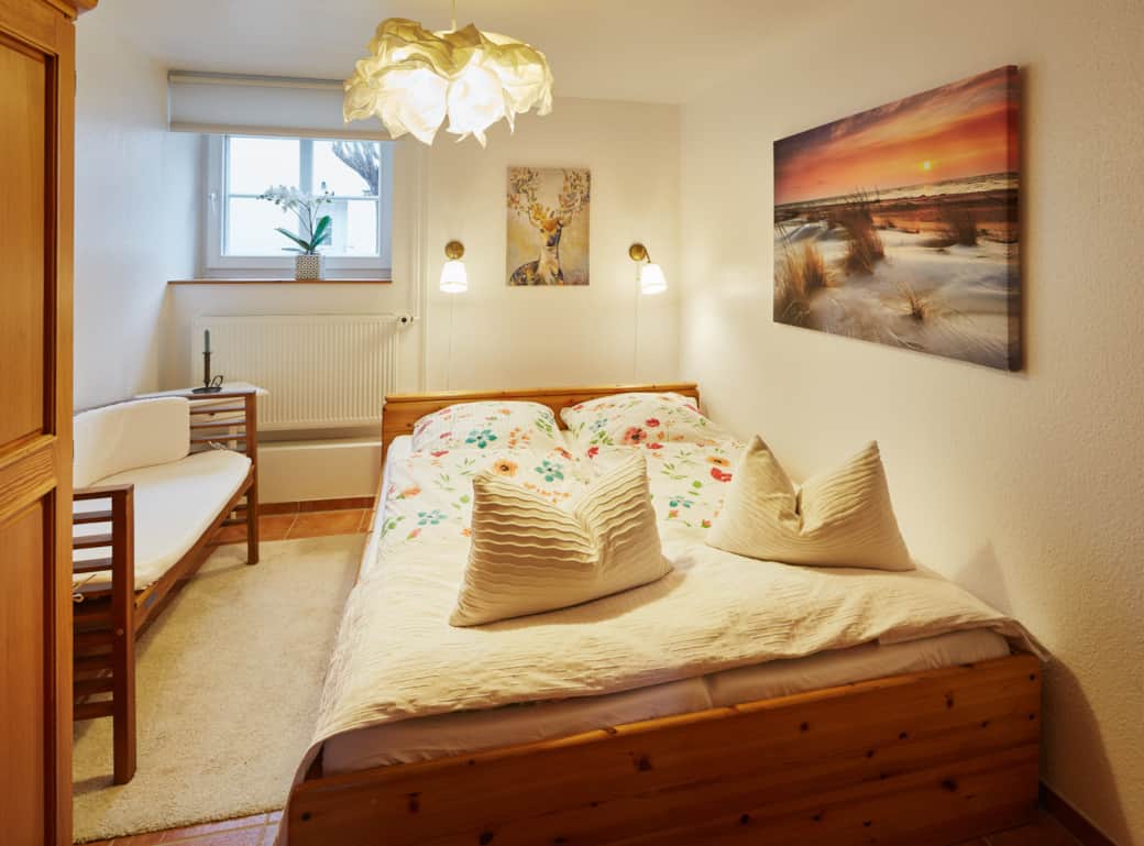The bedroom with king-size bed, smart TV and wardrobe