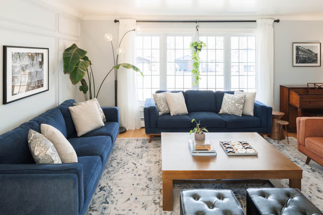Light-filled living room with cozy seating and modern coastal style.