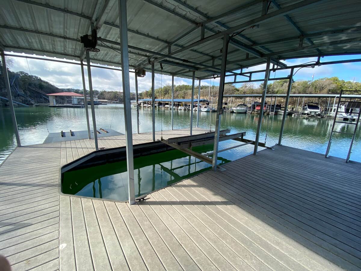 Covered private dock with boat and personal-watercraft lifts