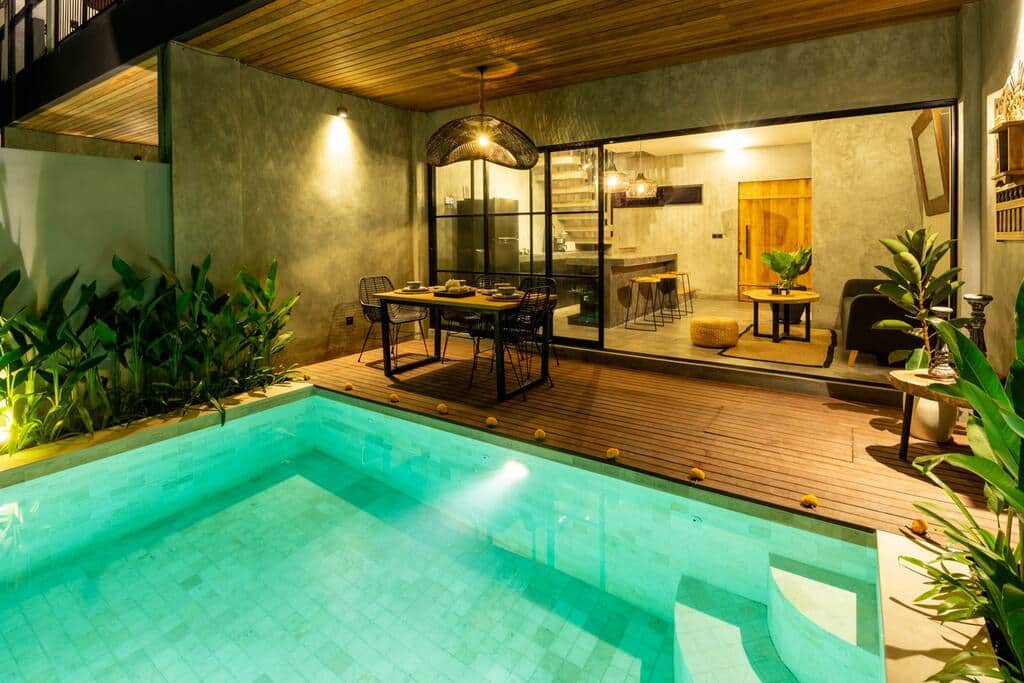 cute stunning outdoor space complete with a plunge pool and romantic outdoor dining.