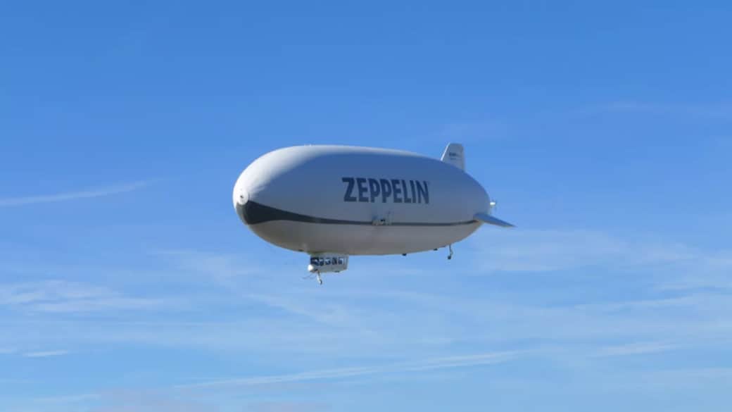Ein Zeppelin schwebt über dem ruhigen See, zeitlos und erhaben. ARISTA Ferienwohnung Friedrichshafen