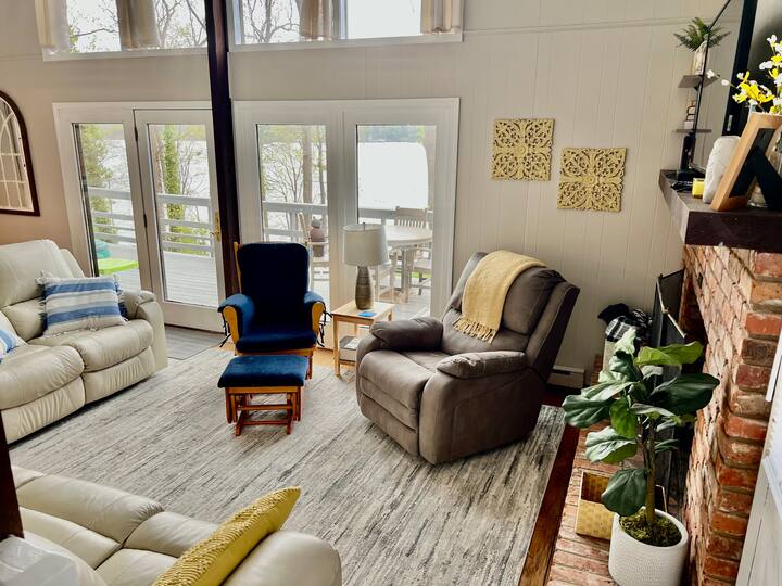 Relax in the living room while enjoying the lake view.