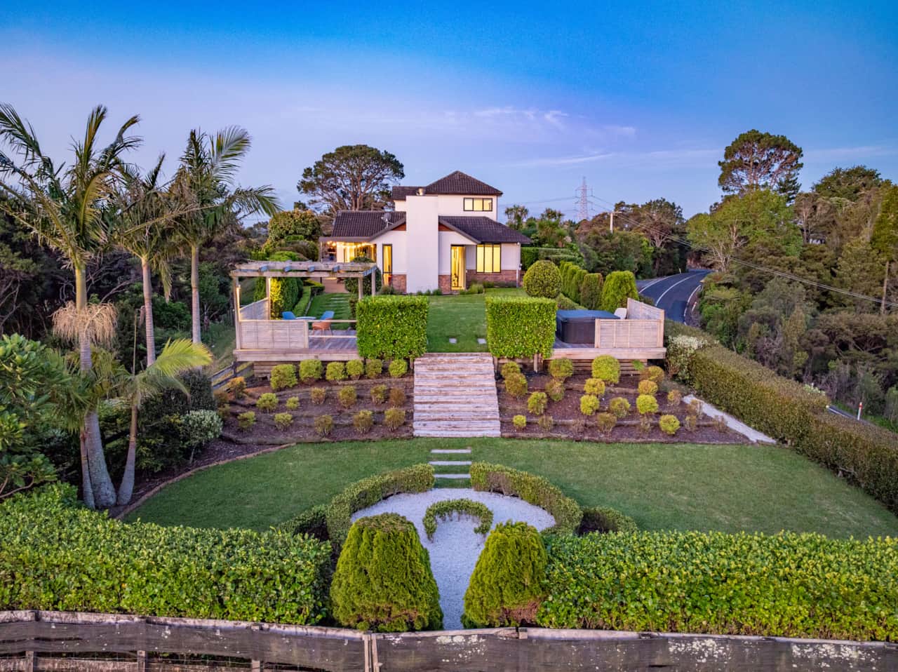 View from the back garden towards the back of the house.  The property has a lot of landscaping
