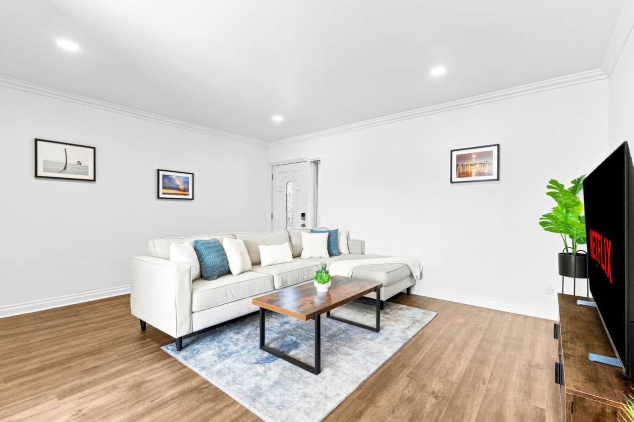 Spacious Living Room W/ Comfortable Sofa & Television. 