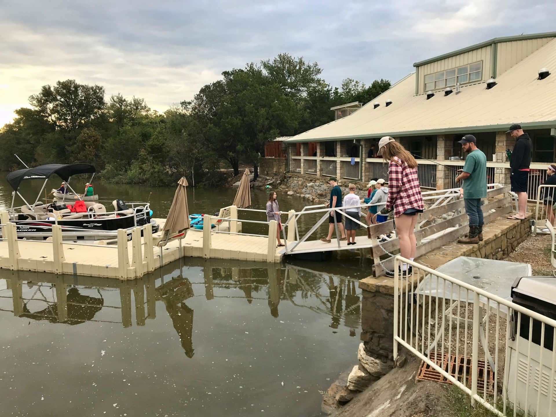 Youth at the lodge dock fishing at Lake Godstone Graford Texas