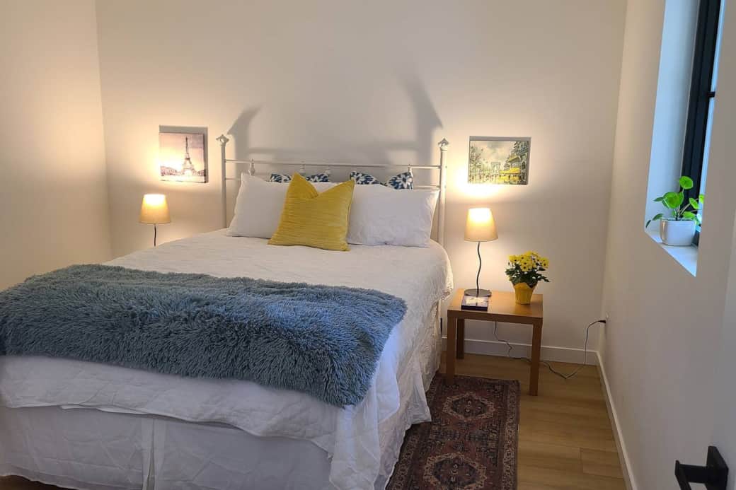 A very comfortable and quiet bedroom with a queen bed. The bathroom is directly beside this room and behind the butler kitchen.