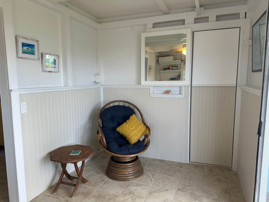 Comfy rocker; door to 1/2 bath to the right of the mirror