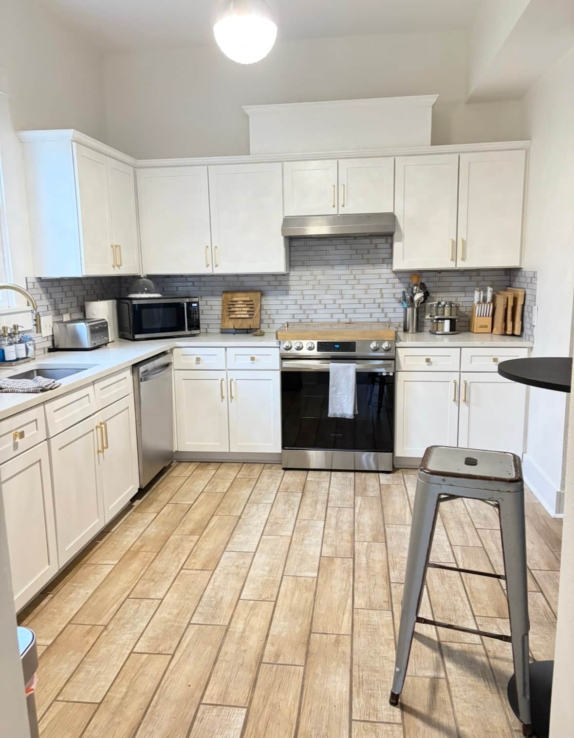 Fully stocked White Magnolia kitchen with coffee station, cookware, and space to prep meals