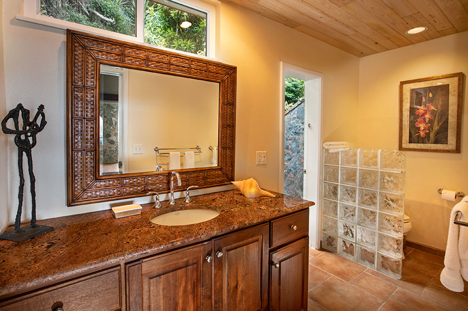 Full bath with outdoor stone shower