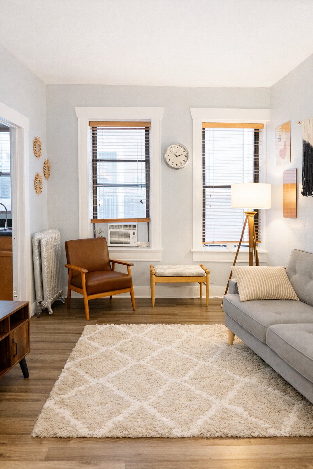 Large windows bring in plenty of natural light, making the living space feel open and welcoming