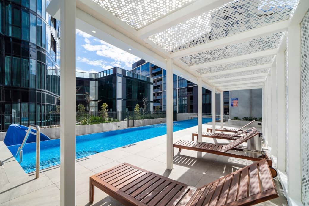 Cool off in our refreshing outdoor swimming pool, complete with comfortable sun loungers under a shaded pergola. It's the perfect for a swim workout or simply unwinding after a busy day. Enjoy the outdoors in style.