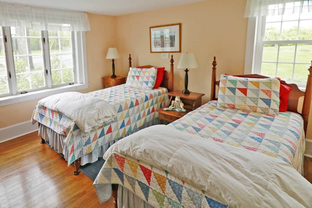 The Peach Room is a bright room on the southwest side of the house, on the main level, has two twin beds, private bathroom, and views of the mountains and fields.