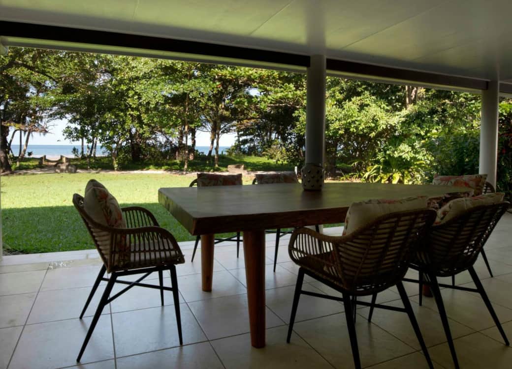 Alani - Beachfront patio with dining to sit at and enjoy the view