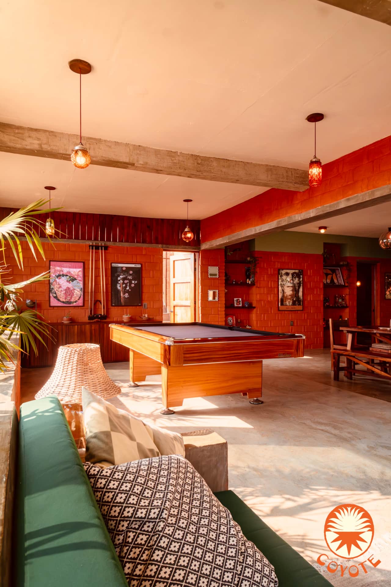 Open-plan living room with pool table, kitchen, and private pool