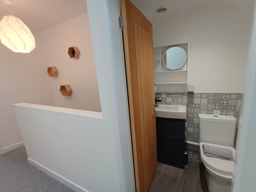 Hallway, with small toilet