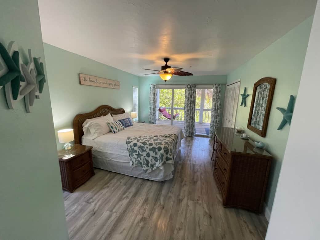Master bedroom. Entrance to screened porch.