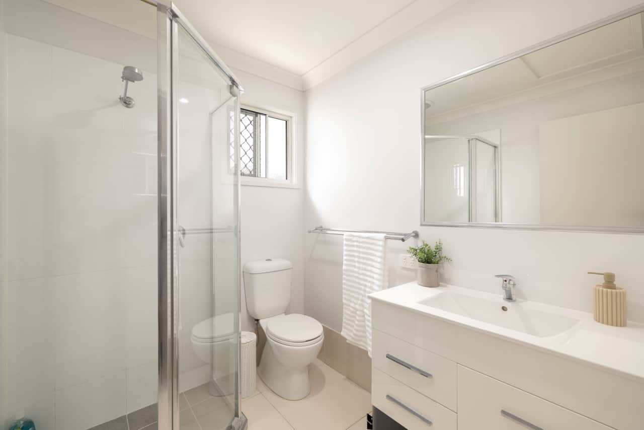 Bathroom: Stylish bathroom with walk-in shower, vanity, and clean finishes 