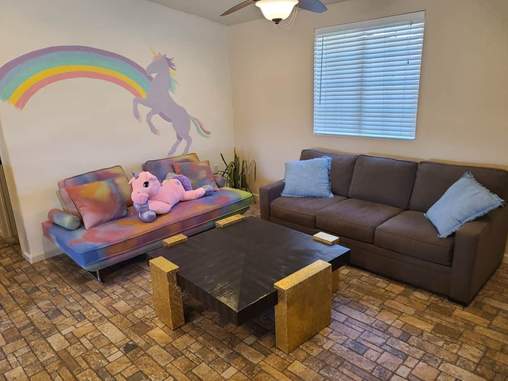 Living room with unicorn mural
