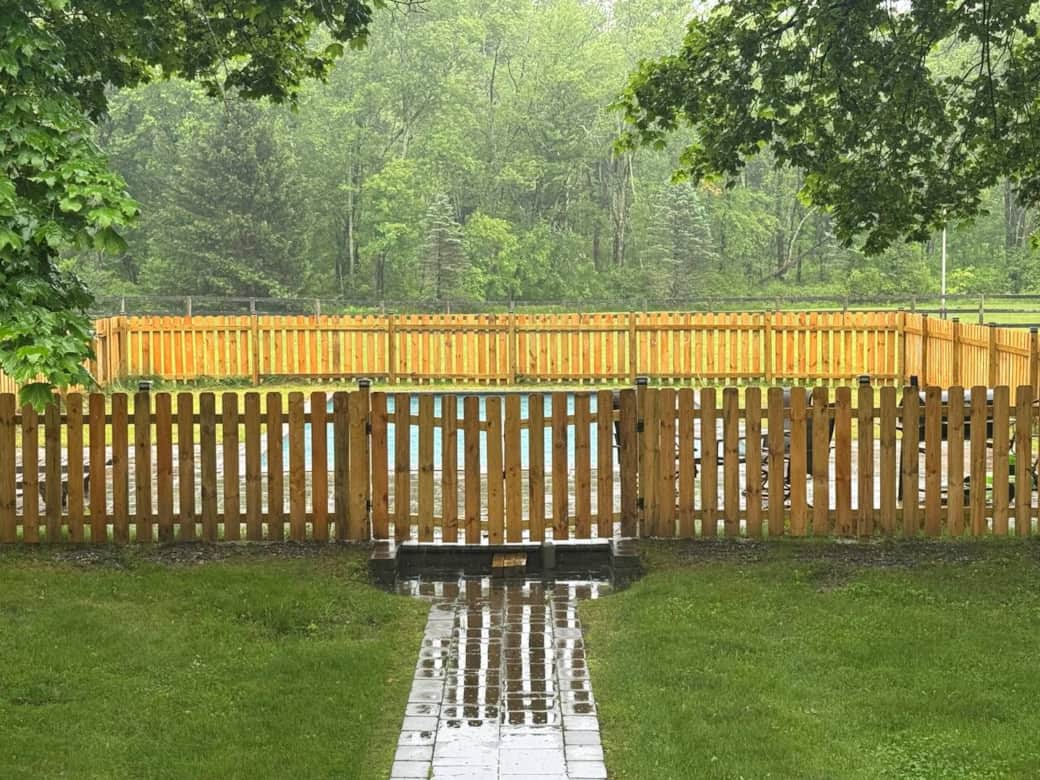 Fenced Pool in the rain