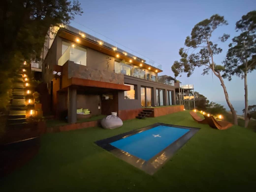 Private backyard of Scandi House Lorne with a sunken trampoline and breathtaking views of Lorne and the Loutit Bay. 