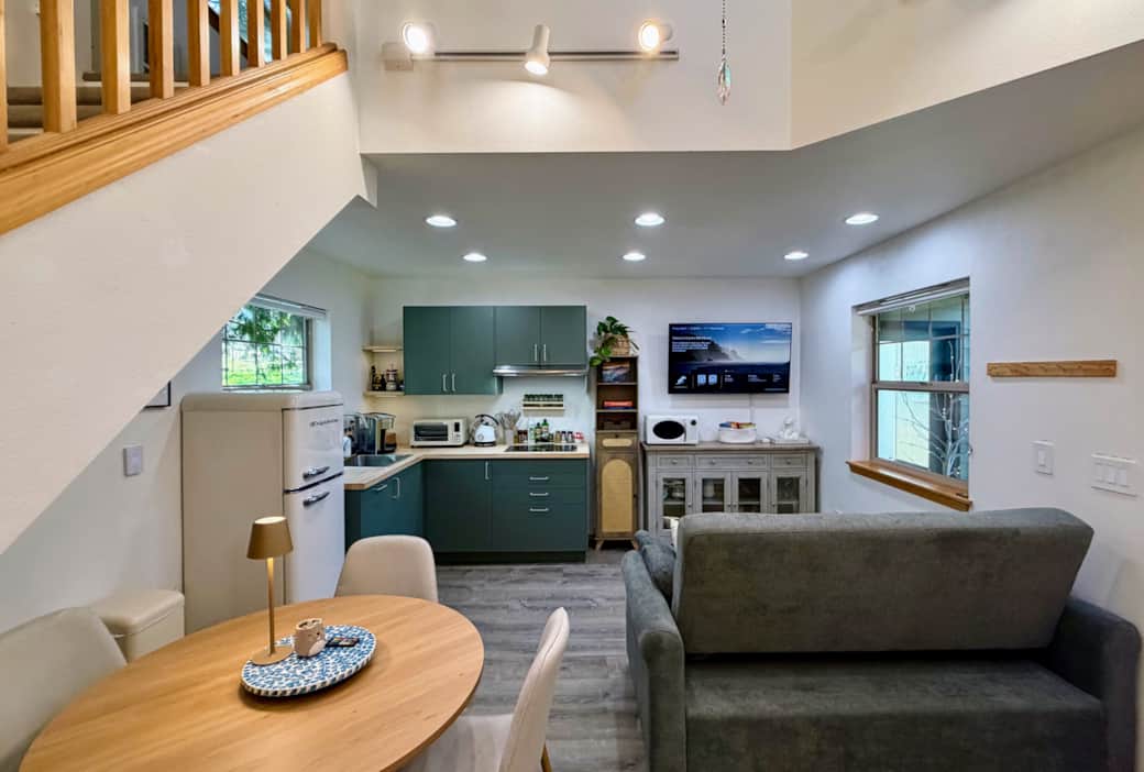 Enjoy meals at the cozy dining table for four, or cook in the fully equipped kitchenette.