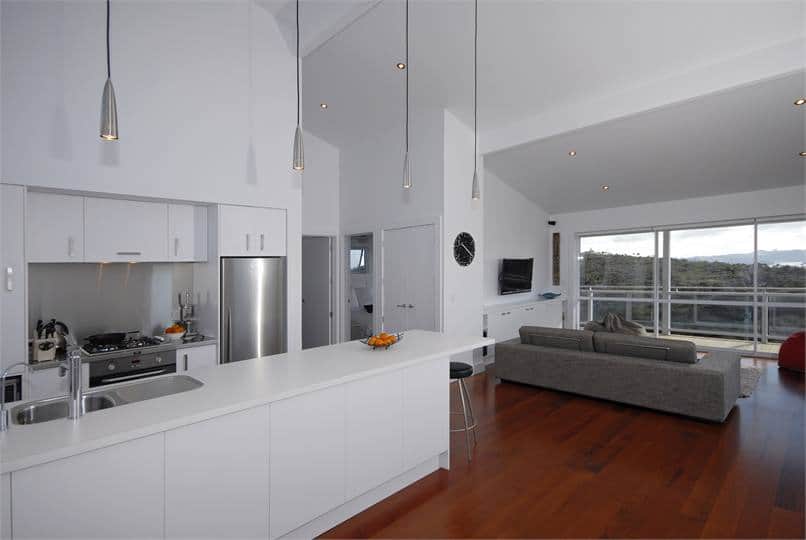 Fully equipped modern kitchen with a stunning view over the Bay of Islands at Wharau Lodge, Kerikeri