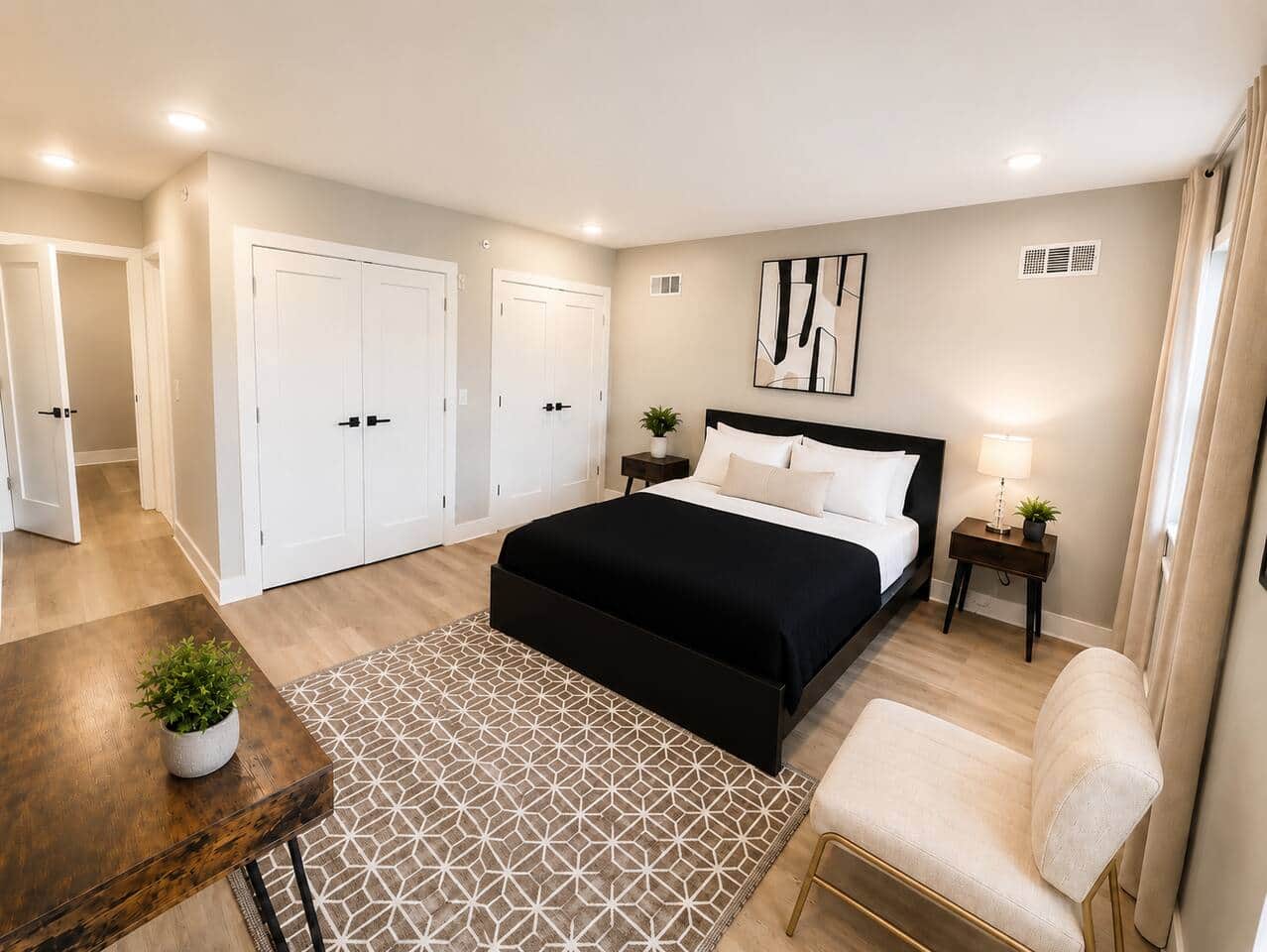 Comfortable private bedroom featuring a queen bed, attached bathroom, Roku TV, and a large closet for plenty of storage. A clean and relaxing space perfect for couples, solo travelers, or longer stays