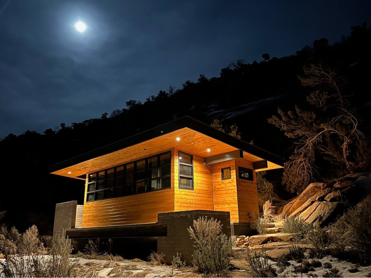 the Shower House nestles up against the cliffs