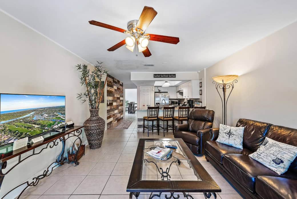 The family room features a smart TV with included cable, comfortable couches, and views of your beautiful outdoor oasis.