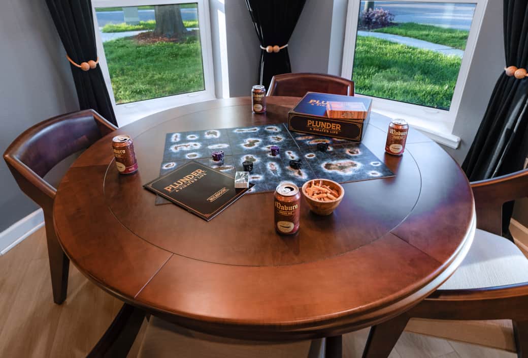 Casual dining nook doubles as game night central. Casual dining nook doubles as game night central.