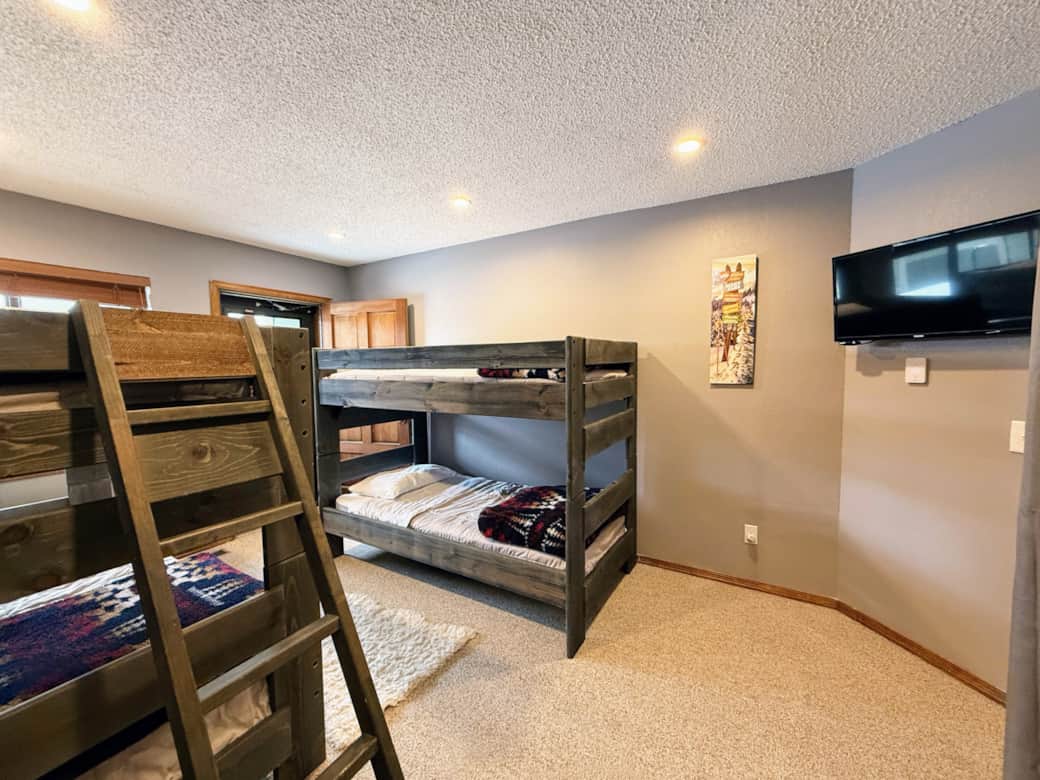 Bedroom #1 has a door to the private patio and a TV with a Roku streaming device.
