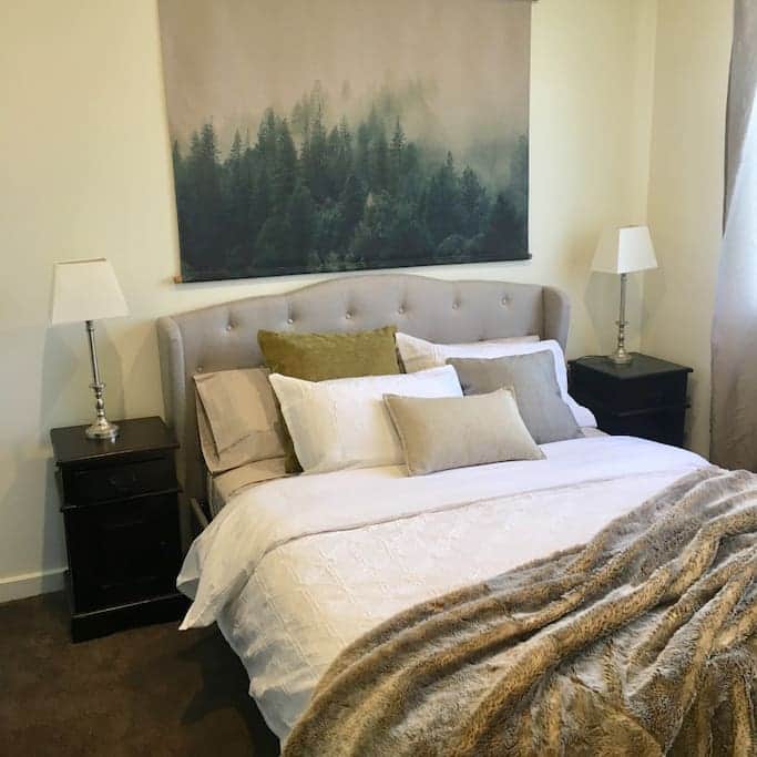 Snuggle up in this luxurious queen size bed of the master bedroom at the Cottage. 