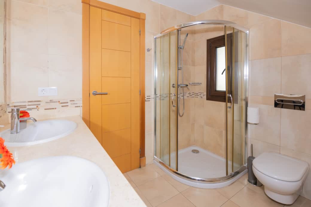 En-suite master bathroom with double sinks, shower, toilet and bidet