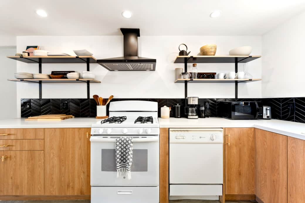 Cook with ease in a fully stocked kitchen — indoor/outdoor dishware, spices, French press + grinder, coffeemaker, blender, toaster & toaster oven included.