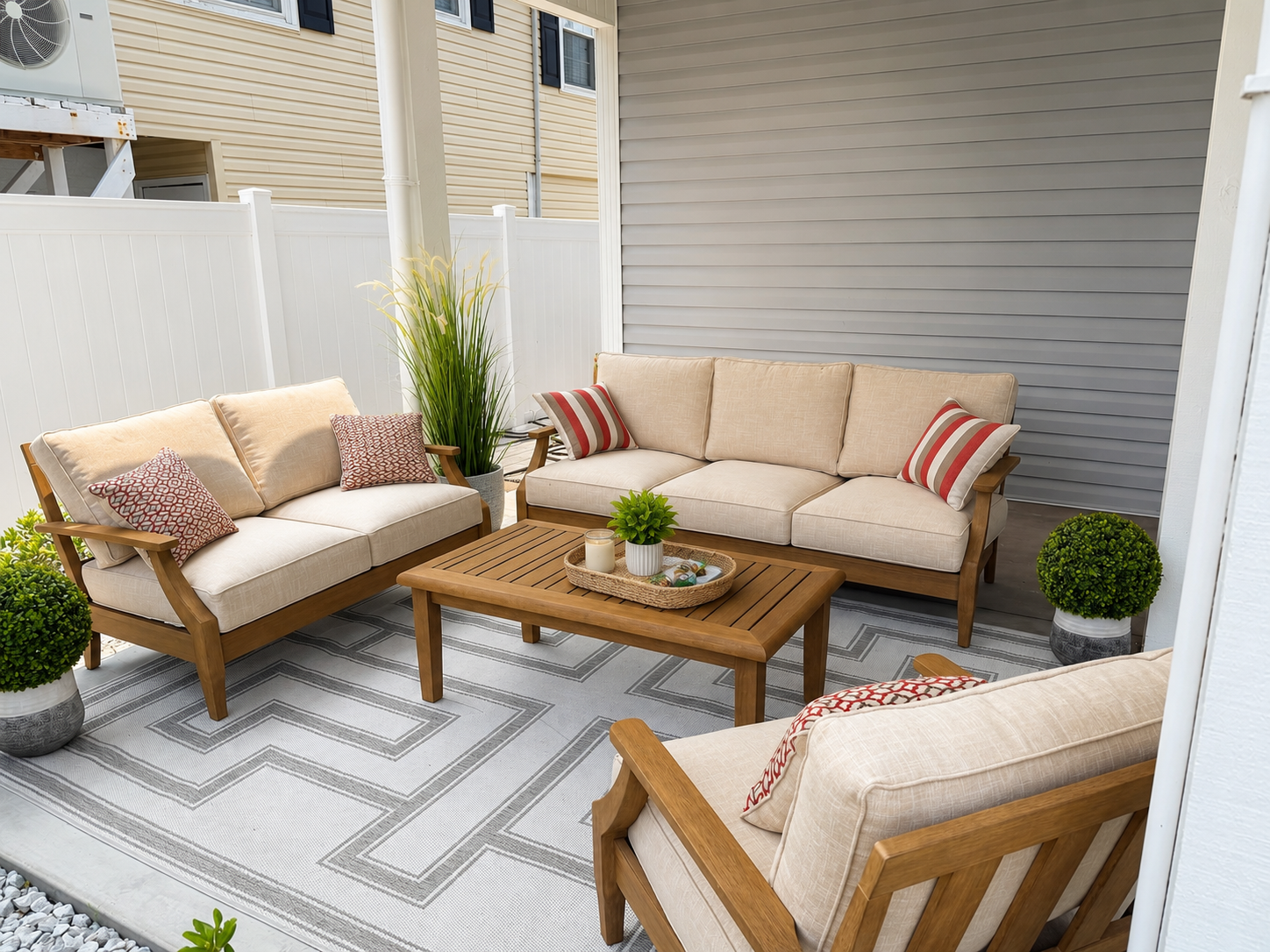 Covered patio with new outdoor furniture at Coastal Crown