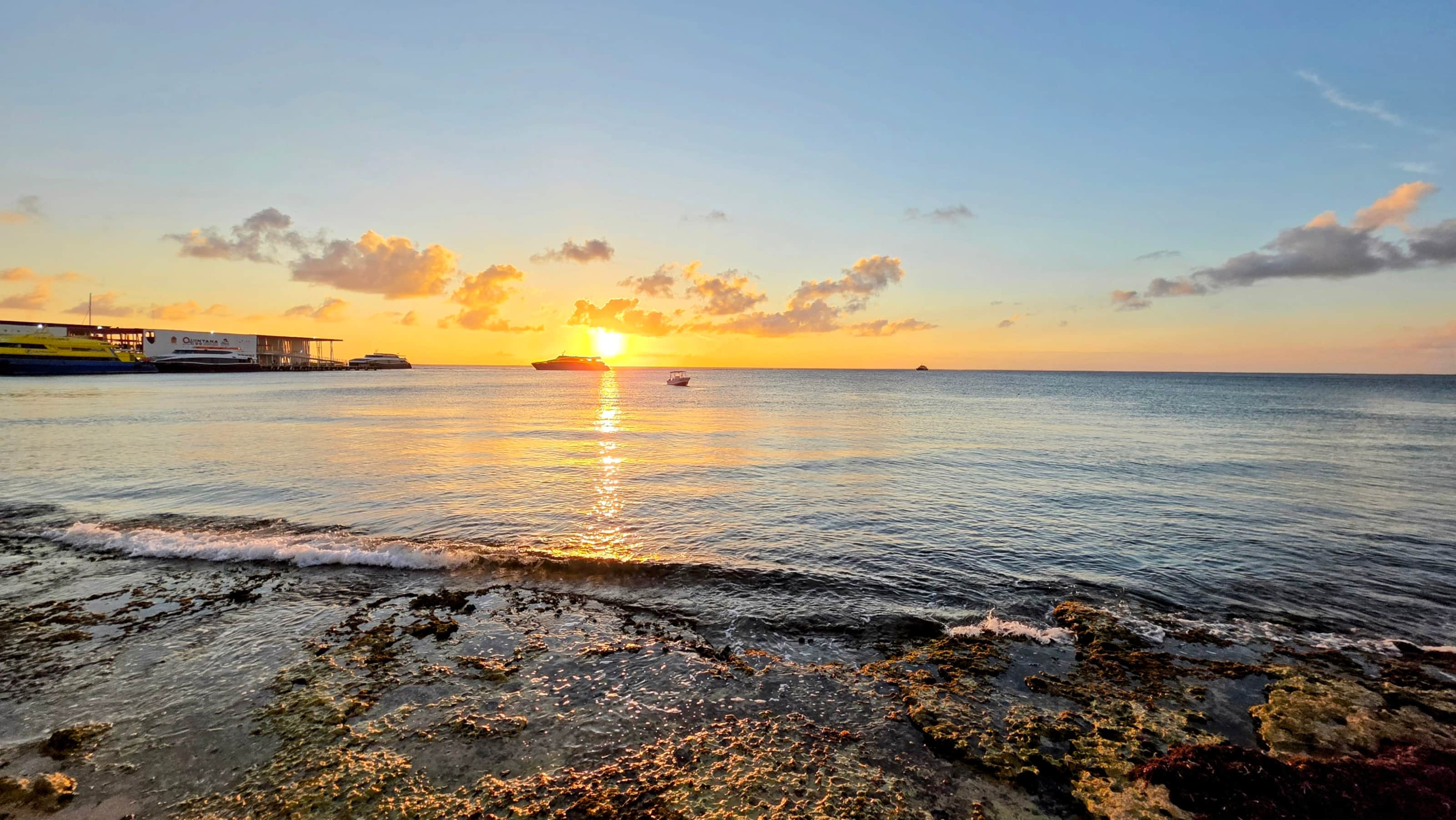 Sunset over the Caribbean Sea and rocky tide pools in Cozumel, Mexico
