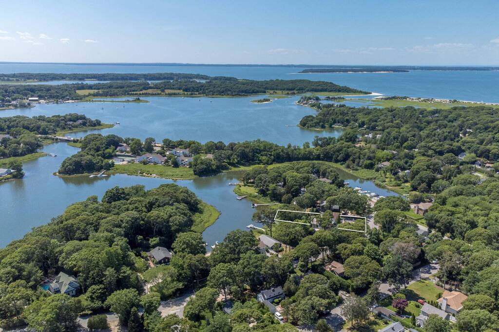 Aerial view of the house, outlined, on Fish Cove with North Sea Harbor beyond