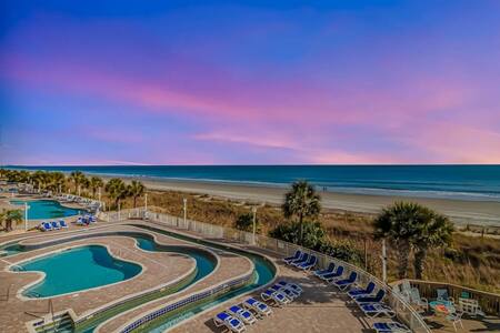 Bay Watch Resort Pool Area At Sunset