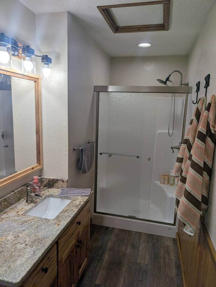 Bathroom with shower hand towels, bath towels, wash clothes, shampoo, conditioner and body wash are supplied. Also toilet paper and hair dryer.