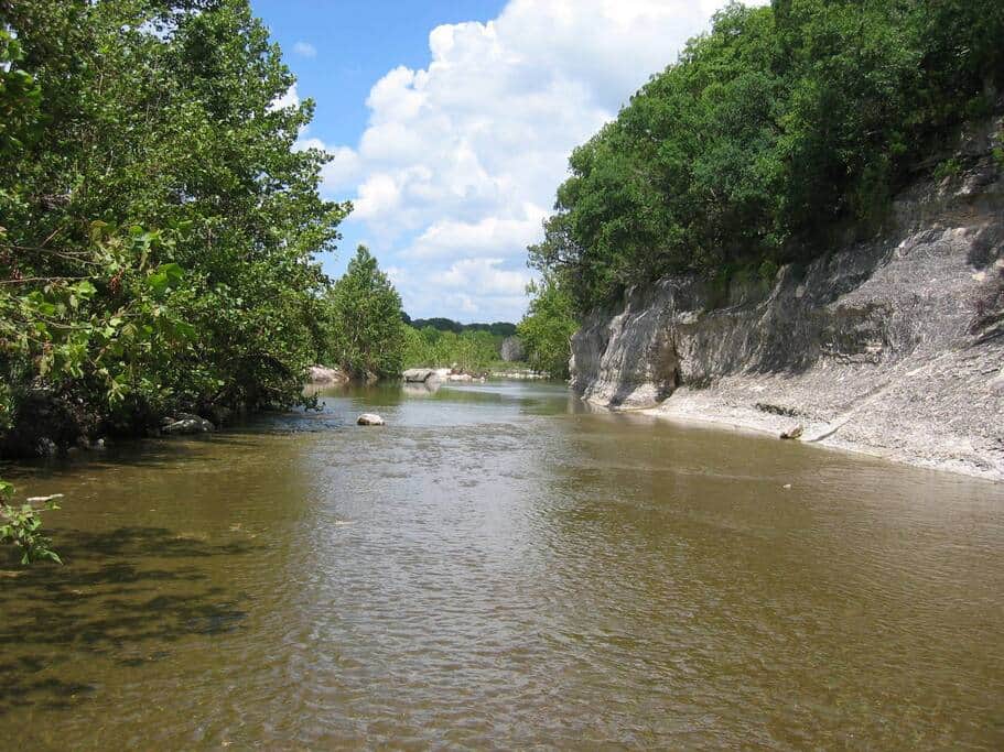 creek at the foot of the bluff